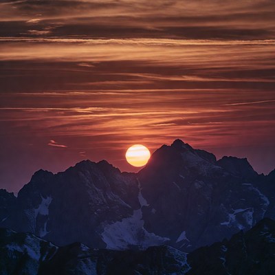 Sunset over Snowy Mountains