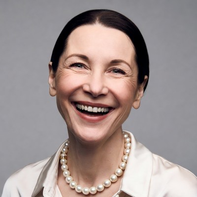 Smiling woman wearing pearl necklace