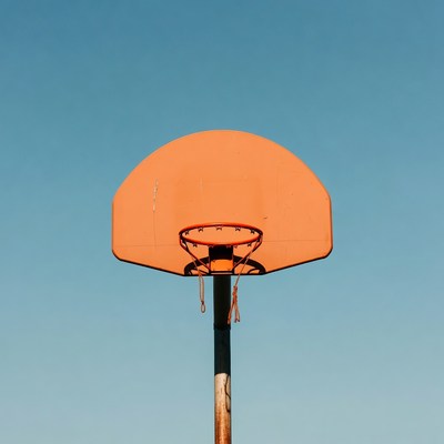 Orange Basketball Hoop on Blue Sky