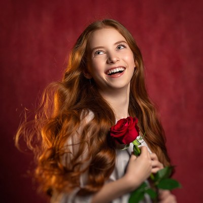 Girl holding red rose