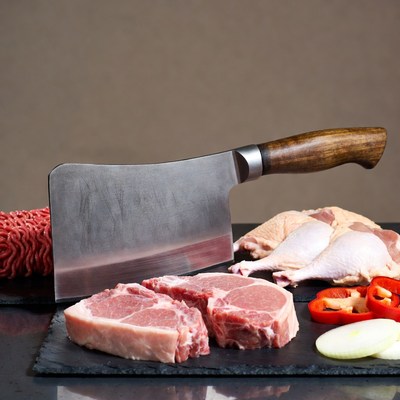 Cleaver with raw pork and chicken