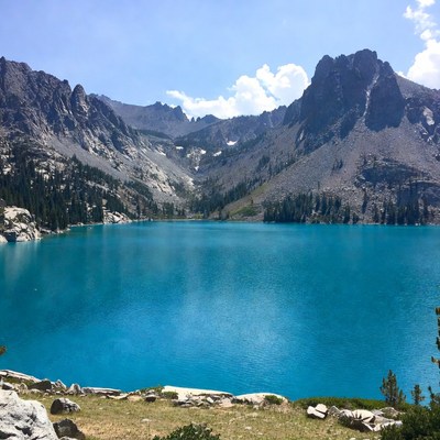 Turquoise alpine lake with mountains