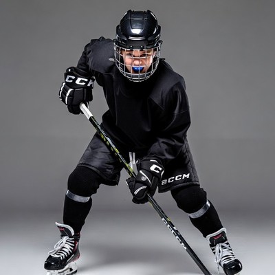 Boy hockey player with stick