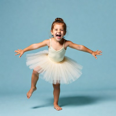 Happy girl in tutu ballet pose
