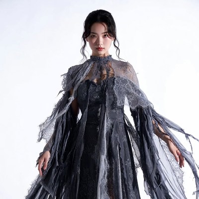 Asian woman in tattered lace gown