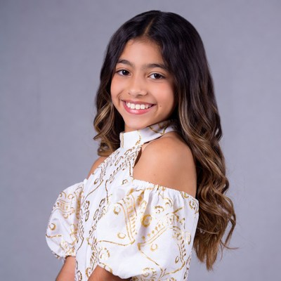 Smiling girl in gold embroidered dress