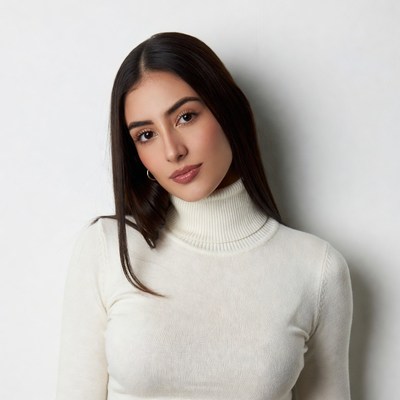 Woman in white turtleneck smiling