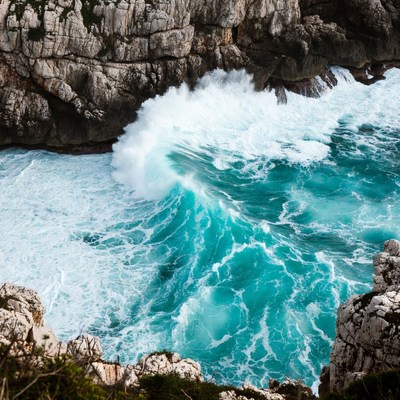 Crashing Waves Against Coastal Cliffs