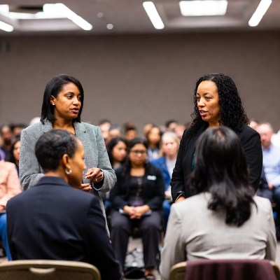 African-American women discussing in conference