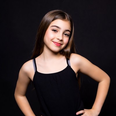 Smiling girl in black tank top