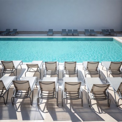 Empty Poolside Lounge Chairs