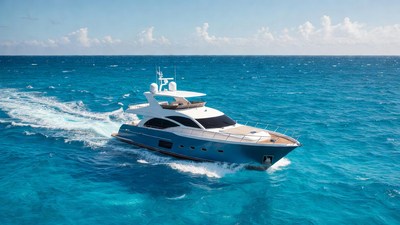 White luxury yacht speeding on turquoise ocean