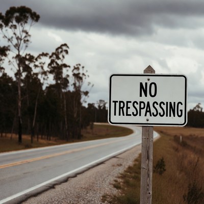 No Trespassing Sign by Rural Road