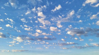 Fluffy Clouds in Blue Sky
