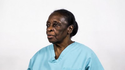 Elderly African-American woman in scrubs