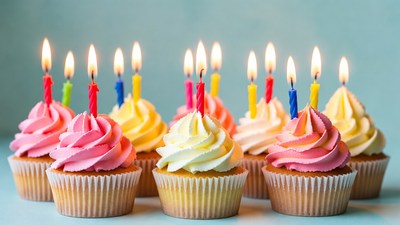 Cupcakes with lit birthday candles