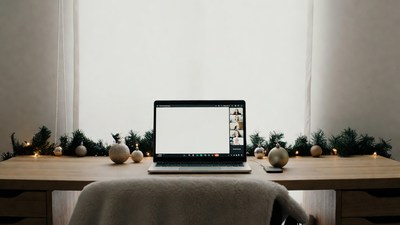 Laptop with Zoom call on Christmas desk