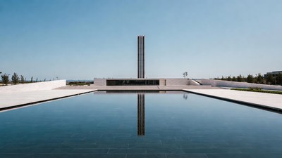 Tall Monument Reflecting in Pool