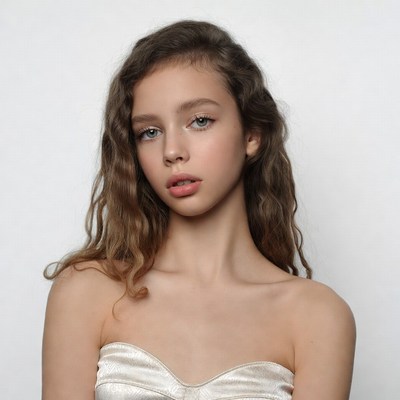 Teen girl in gold tube top