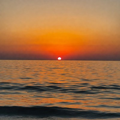 Sunset over calm ocean
