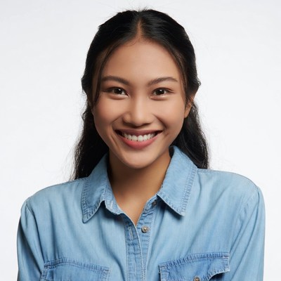 Smiling Asian woman in denim shirt