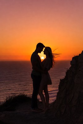 Silhouette couple embracing at sunset