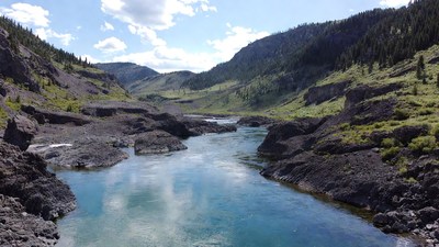 Turquoise River in Mountain Valley