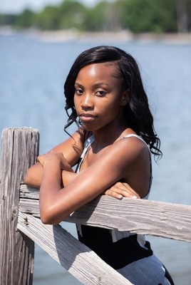 African-American woman leaning on dock