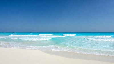 Turquoise Ocean Waves Crashing on Beach