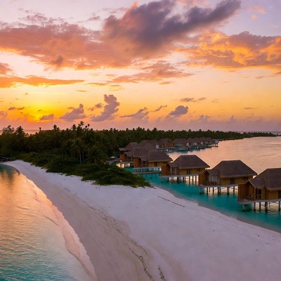 Overwater bungalows at Maldives sunset