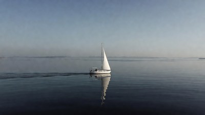White sailboat on calm water