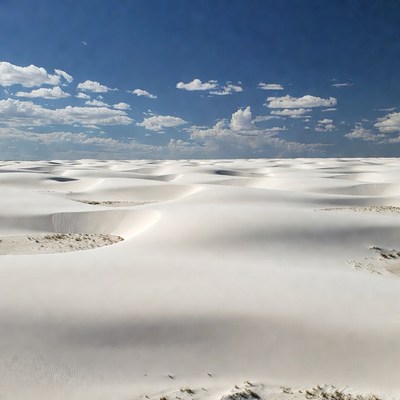 White Sand Dunes Under Blue Sky