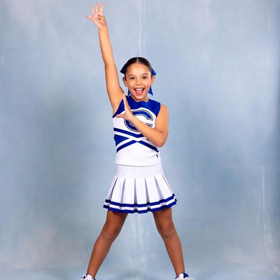 Latina girl cheerleader posing energetically