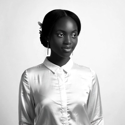 African-American woman in white shirt