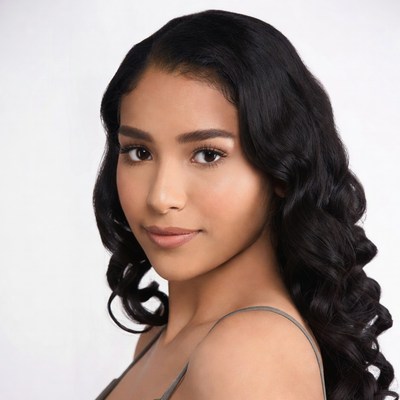 Beautiful young woman with curly black hair