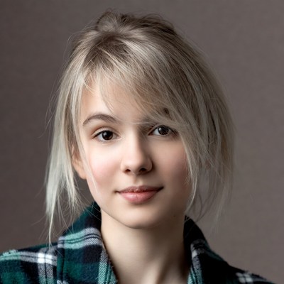 Young woman with blonde hair smiling