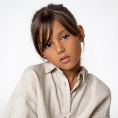 Young girl with bangs on white background