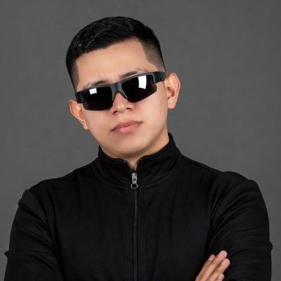 Asian man in sunglasses with arms crossed