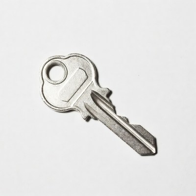 Silver house key isolated