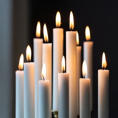 Cluster of lit white candles