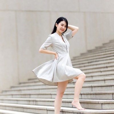 Asian woman posing on stairs