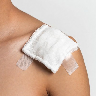 Asian woman with shoulder bandage