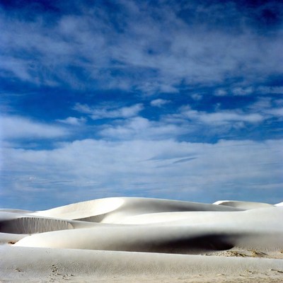 White Sand Dunes Under Blue Sky