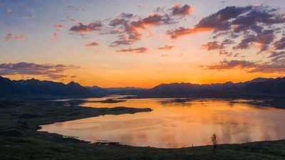 Sunset over mountains and lake