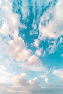 Fluffy White Clouds in Blue Sky