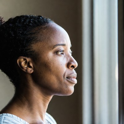 African-American woman profile by window