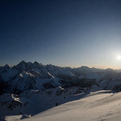 Snowy Mountain Peaks at Sunrise
