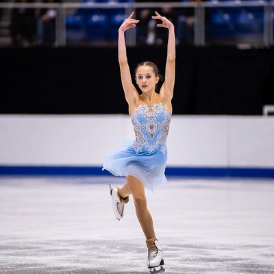 Young woman figure skating on ice