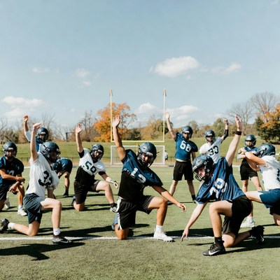 Football team celebrating on field