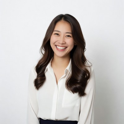 Smiling Asian woman in white shirt